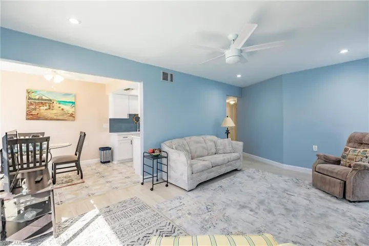 Living room featuring light hardwood / wood-style flooring and ceiling fan