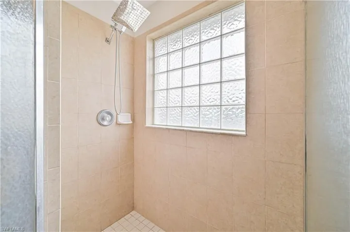 Bathroom featuring a tile shower