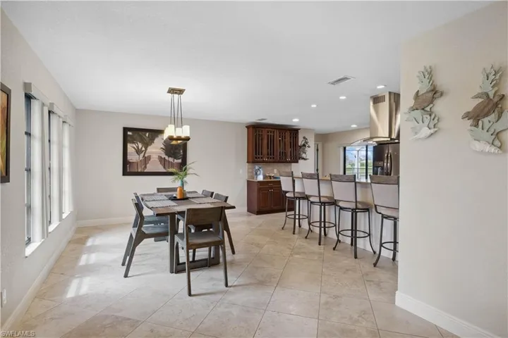 Dining space featuring baseboards and recessed lighting