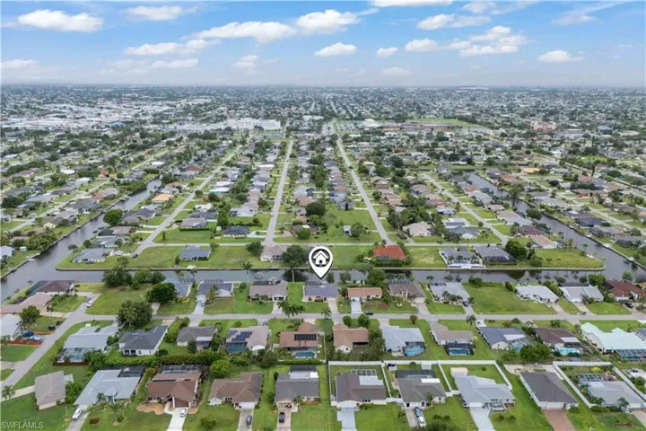 View of property location with nearby suburban area and a large body of water