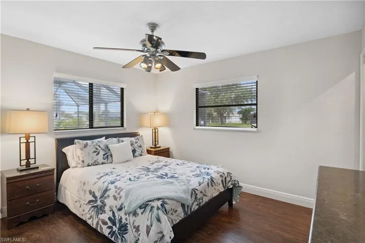 Bedroom featuring wood finished floors and ceiling fan