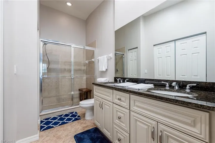 Primary Bathroom with Dual Sinks & a Large Glass Shower
