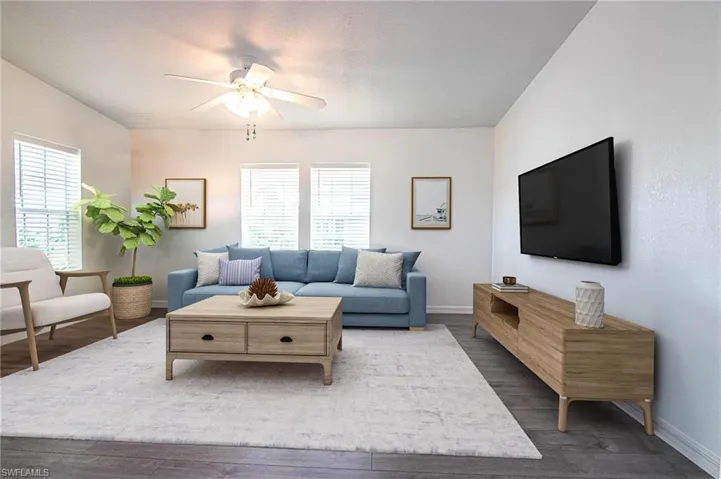 LIVING ROOM OPENS TO THE DINING ROOM AND KITCHEN. VAULTED CEILINGS. REMODELED. NEW LUXURY VINYL PLANK FLOORING.