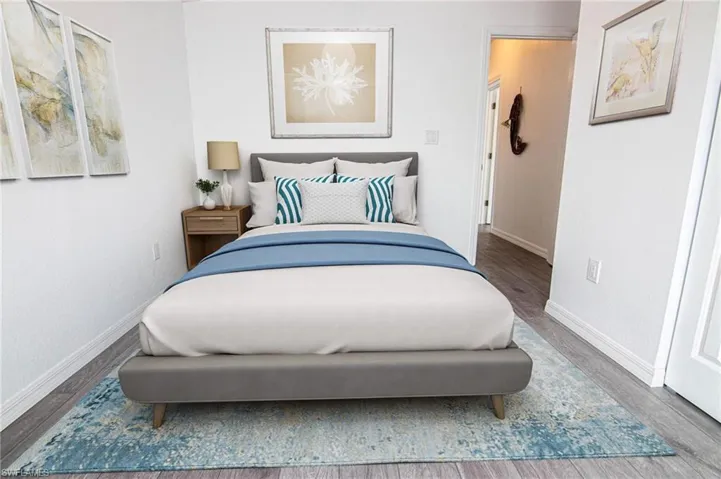 BEDROOM #2 - NEW LUXURY VINYL PLANK FLOORING THROUGHOUT. CUSTOM CLOSET SHELVING. CLOSET IS OPEN FROM WALL TO WALL INSIDE.