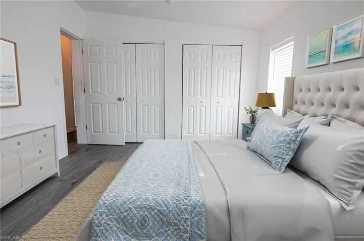 MAIN BEDROOM - NEW LUXURY VINYL PLANK FLOORING THROUGHOUT. CUSTOM CLOSET SHELVING. CLOSET IS OPEN FROM WALL TO WALL INSIDE.