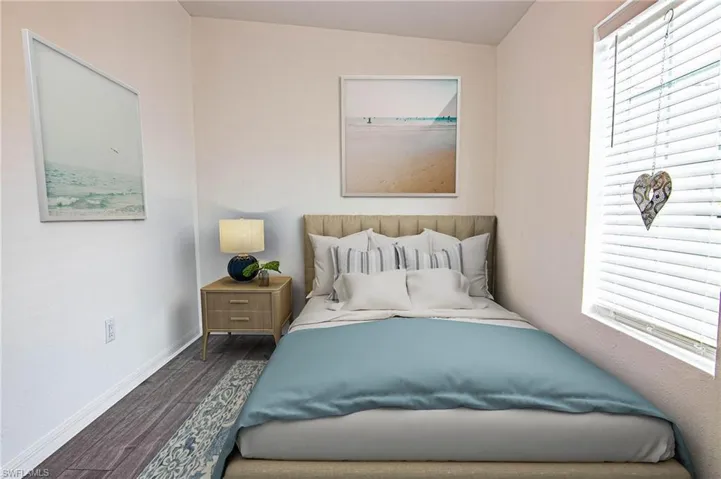 BEDROOM #2 - NEW LUXURY VINYL PLANK FLOORING THROUGHOUT. CUSTOM CLOSET SHELVING. CLOSET IS OPEN FROM WALL TO WALL INSIDE.