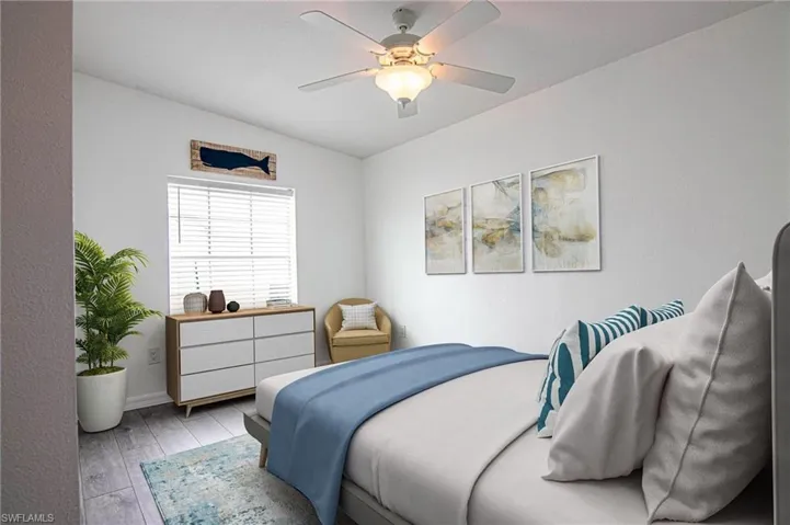 BEDROOM #2 - NEW LUXURY VINYL PLANK FLOORING THROUGHOUT. CUSTOM CLOSET SHELVING. CLOSET IS OPEN FROM WALL TO WALL INSIDE.