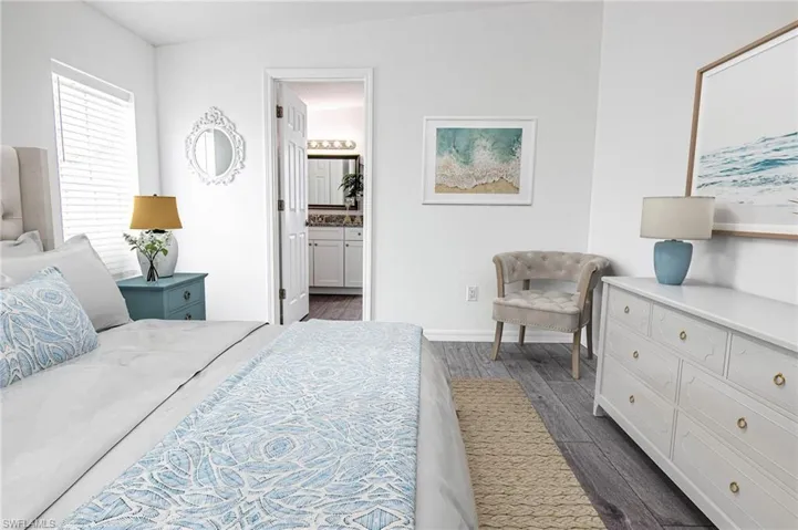 MAIN BEDROOM - NEW LUXURY VINYL PLANK FLOORING THROUGHOUT. CUSTOM CLOSET SHELVING. CLOSET IS OPEN FROM WALL TO WALL INSIDE.