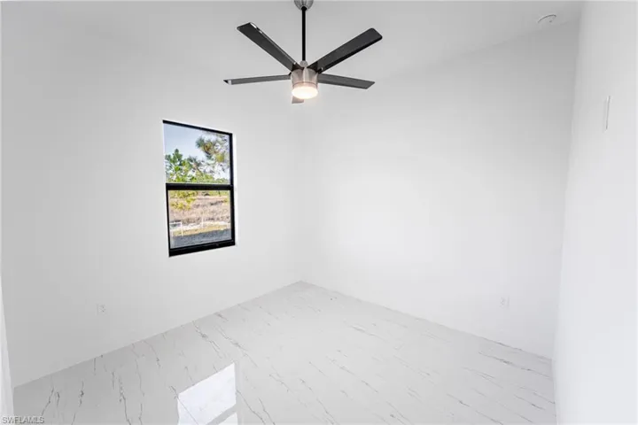 Unfurnished room with ceiling fan