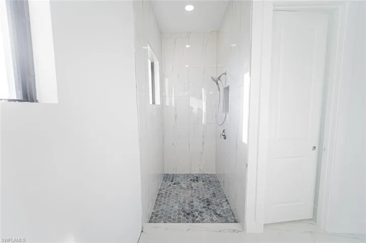Bathroom with a tile shower