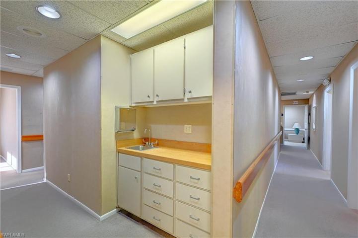 Hallway with sink and work station