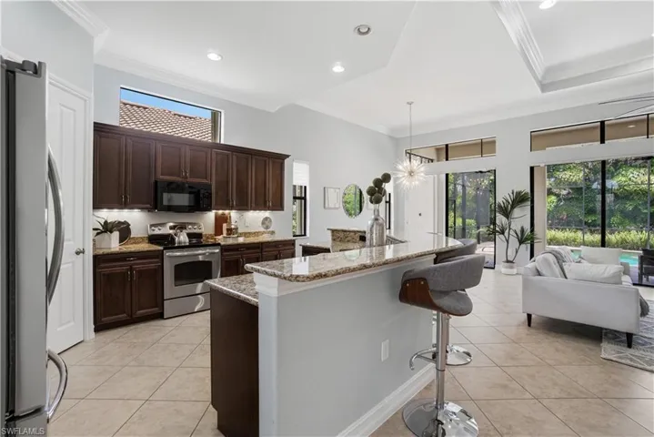 Gourmet kitchen with granite countertops and rich cabinetry