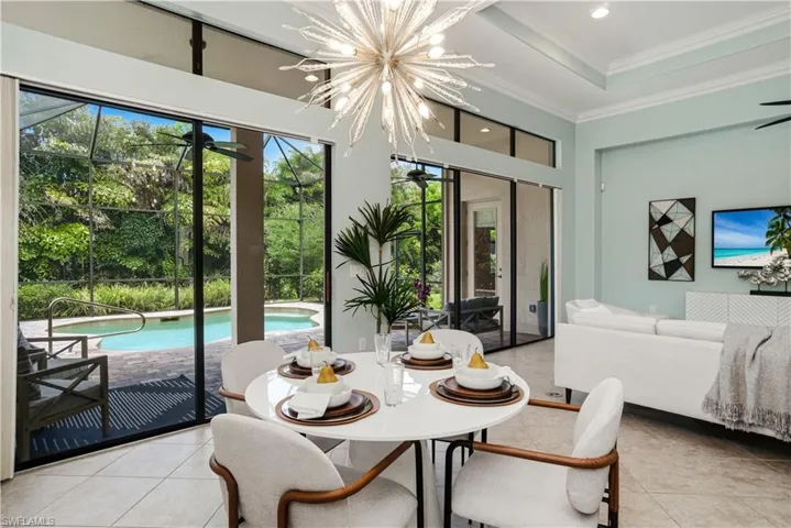 Dining area with beautiful natural light and pool views