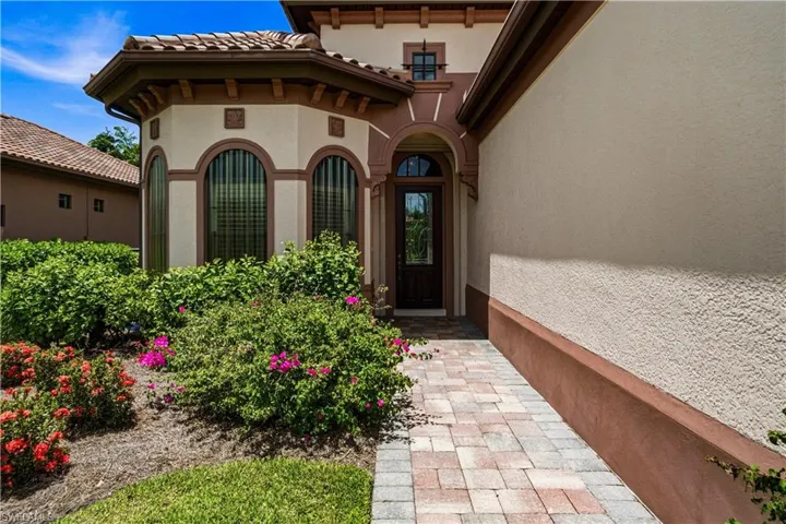 Elegant covered front entry with upscale architectural details