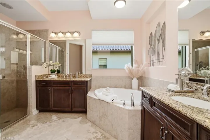 Spa-like bathroom featuring walk-in shower and spacious layout