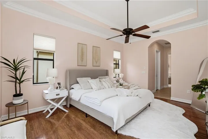 Spacious primary suite with tray ceiling detail