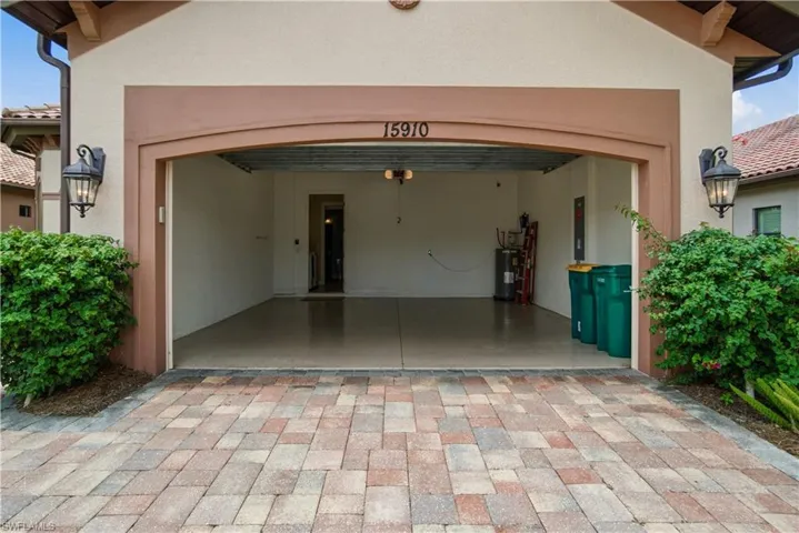 Attached garage with spacious paver driveway