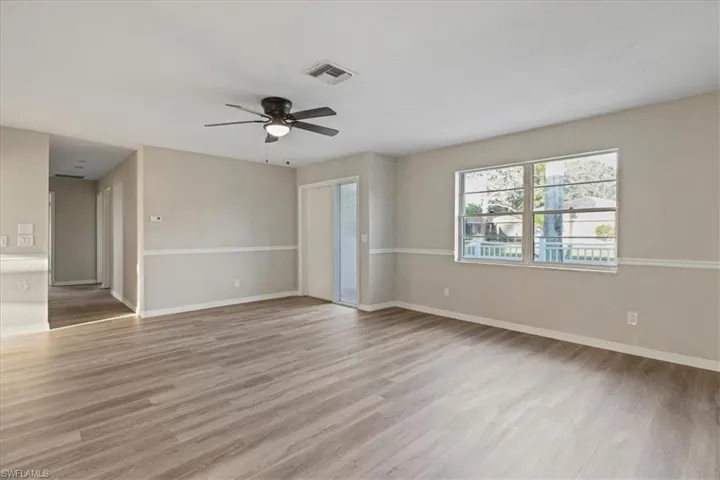 Empty room with light wood-style flooring and a ceiling fan