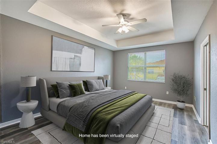 Primary Suite - Vinyl floor and large window for natural lighting