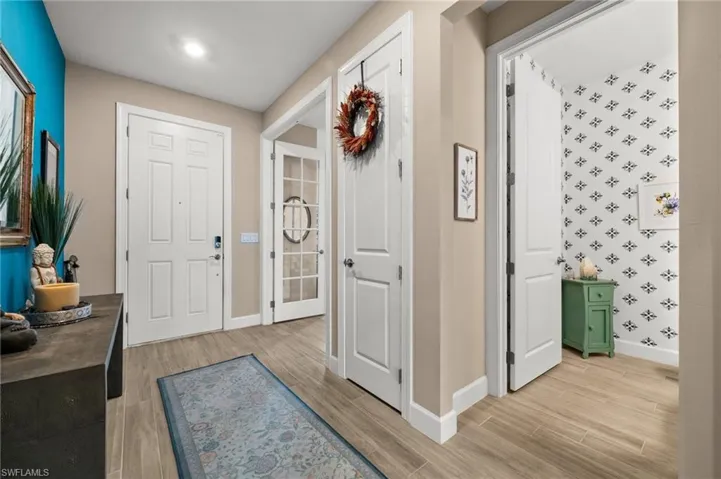 Foyer entrance with light wood-look tile flooring