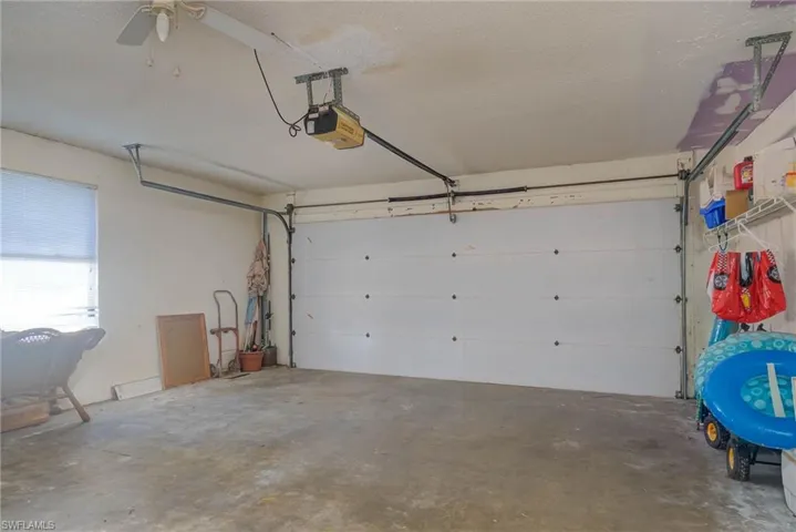 Garage featuring a garage door opener