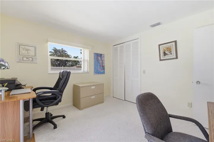 Guest Bedroom 2 with slider door access to pool area