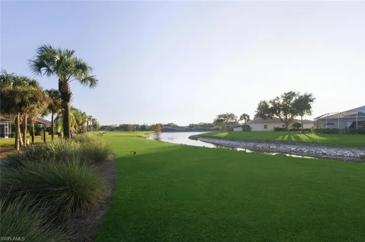 View of green lawn with a water view