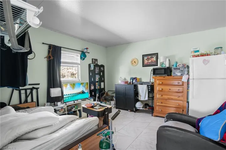 Storage room on patio used as a bedroom