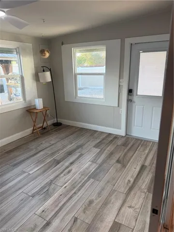 Entrance foyer with light wood-type flooring