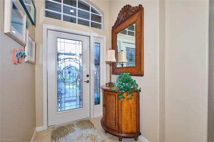 Foyer entrance with baseboards
