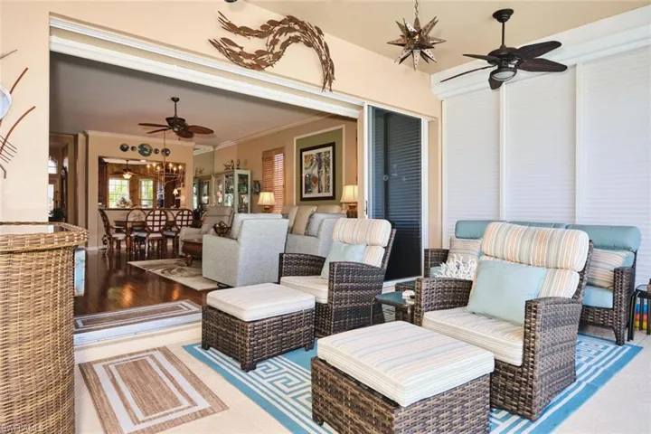 View of patio with a ceiling fan and an outdoor living / dining area