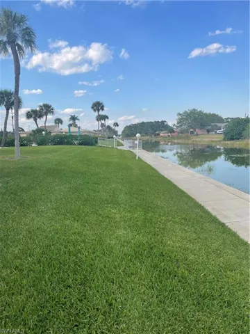 View of yard with a water view