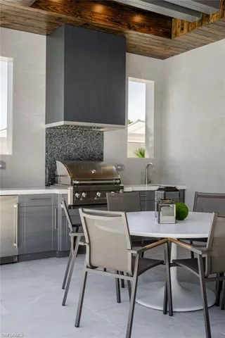 View of patio / terrace with outdoor dining area and a sink
