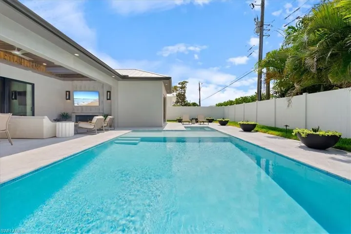 View of pool featuring a fenced backyard and a patio