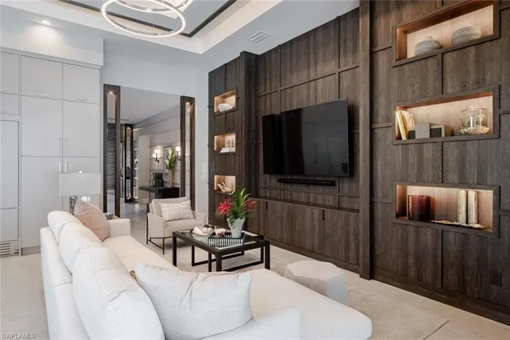 Living area featuring wooden walls