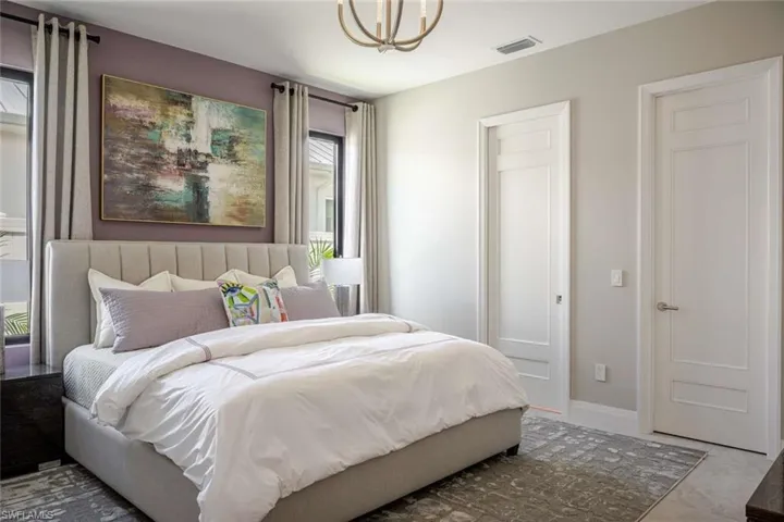 Bedroom featuring a chandelier