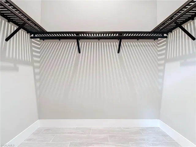 Walk in closet featuring hardwood / wood-style floors