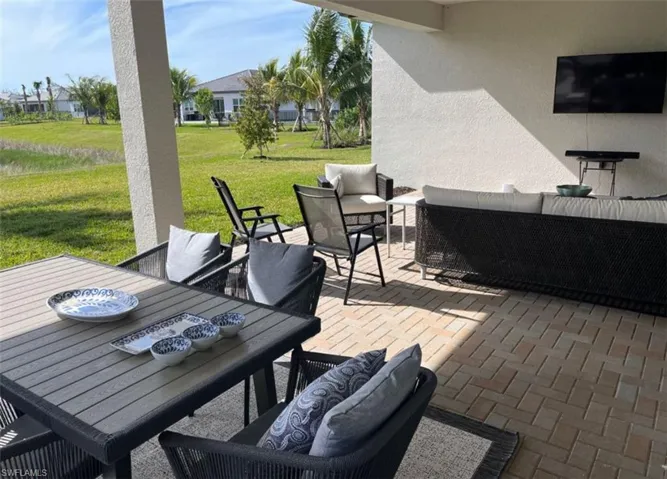 View of patio with an outdoor living space and outdoor dining area