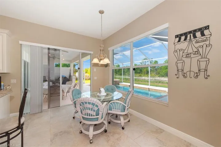 This is the dining area just off the kitchen which gives you a great view of the preserve and the pool area.