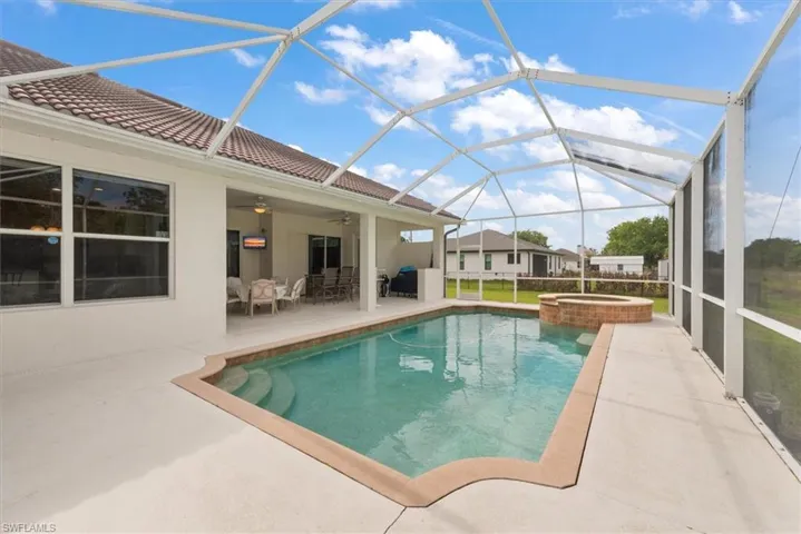 Great day to enjoy the pool or relax in the covered lanai area.