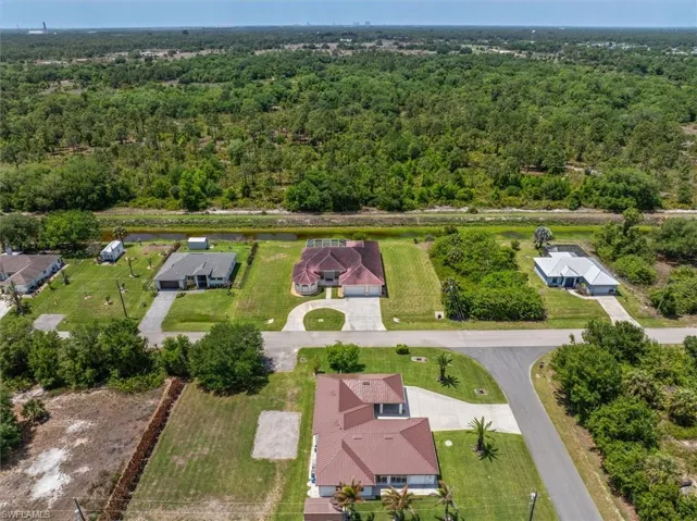 Nice drone view showing the preserve beyond the home.
