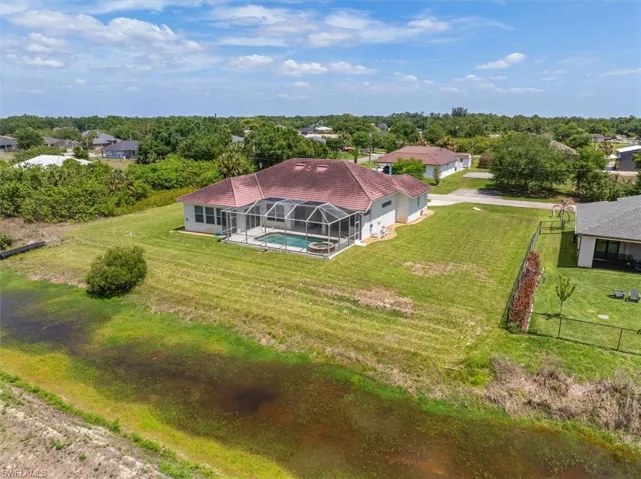 This view you can notice the water drainage canal behind the home which gives you an added buffer behind the home.