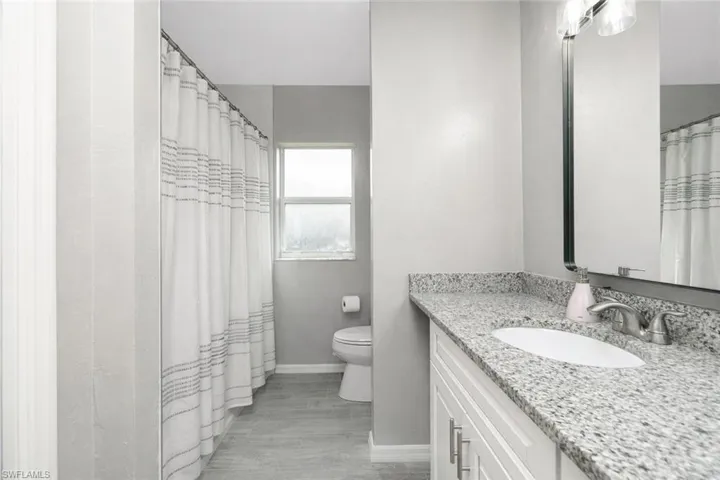 Bathroom with vanity and a shower with curtain