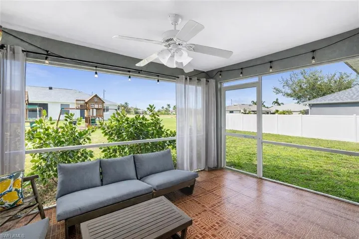 Sunroom featuring ceiling fan and outdoor lounge area