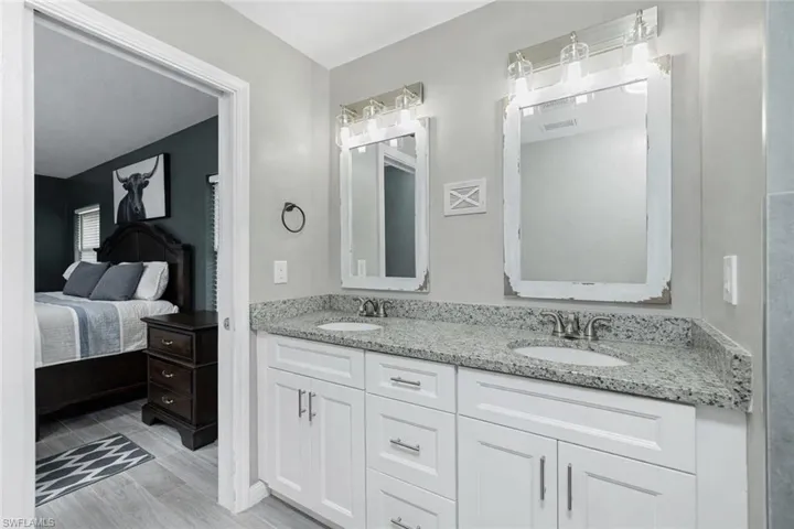 Ensuite bathroom featuring double vanity