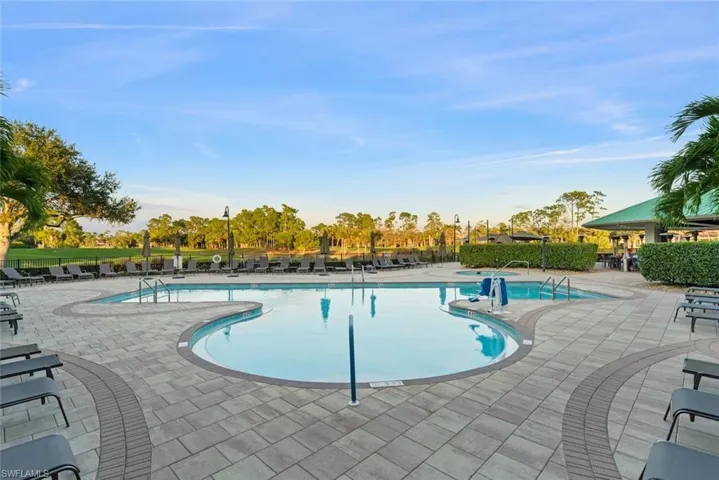 Forest Glen's Community pool featuring a patio