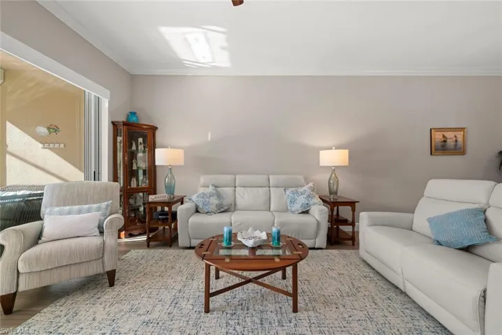 Living room featuring crown molding