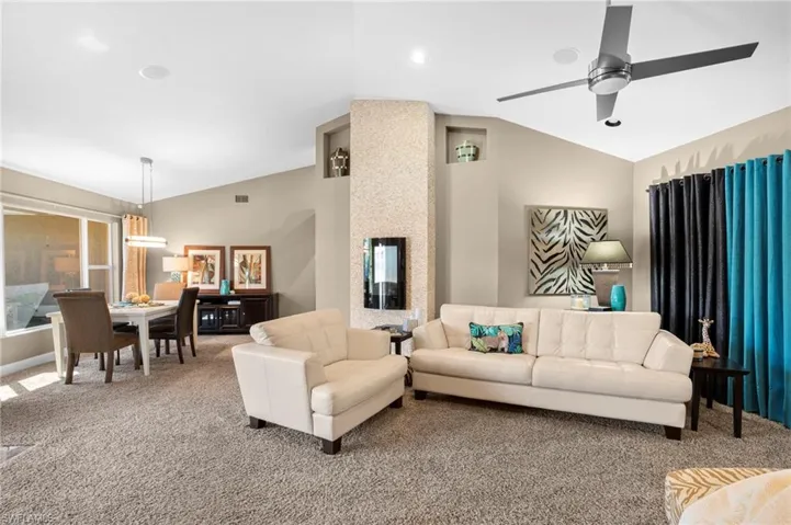 Living/dining area provides for a beautiful setting for your guests  and features an in-wall electric fireplace for show of heating.