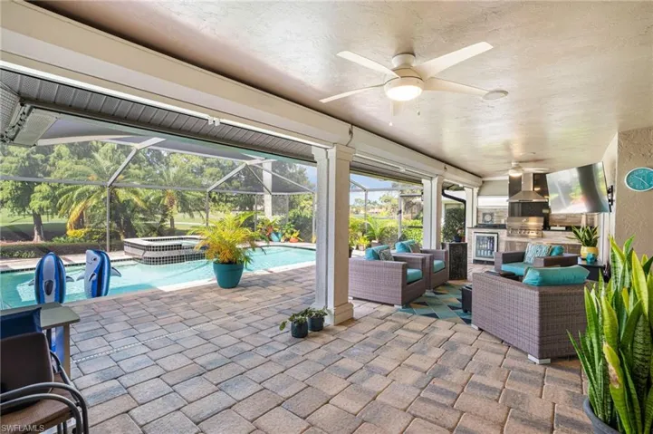 Large attractive pavers enhance the lanai deck and pool area. Roll-down shutters provide extra security and protection from tropical winds.
