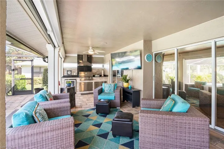 Patio offers built-in kitchen and spacious outdoor living area.